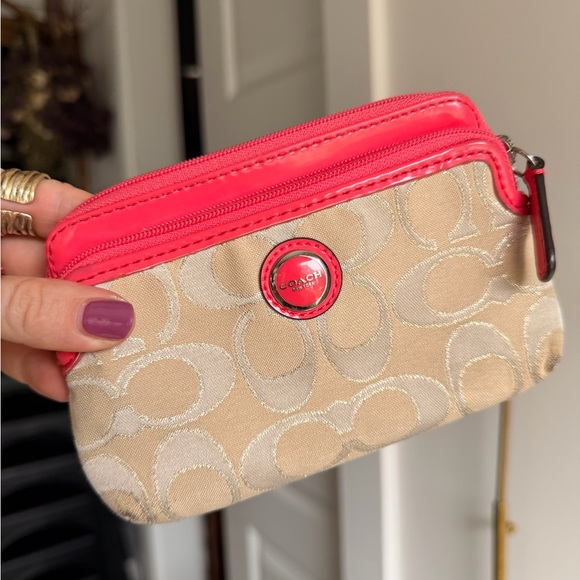 Coach Handbags - Coach Beige Signature Wristlet with Coral Trim